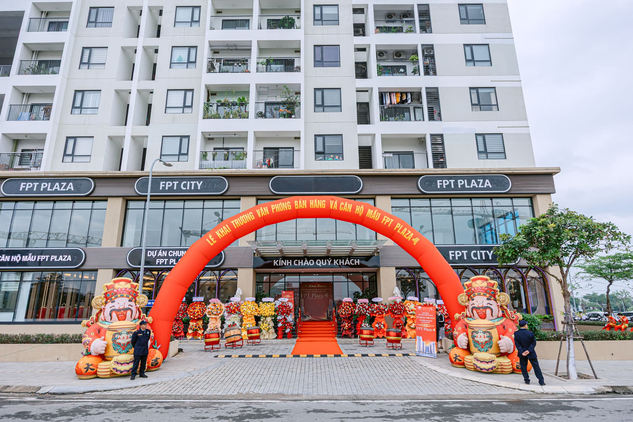 Entrance of FPT Plaza featuring a grand red arch and festive decorations for a promotional event.