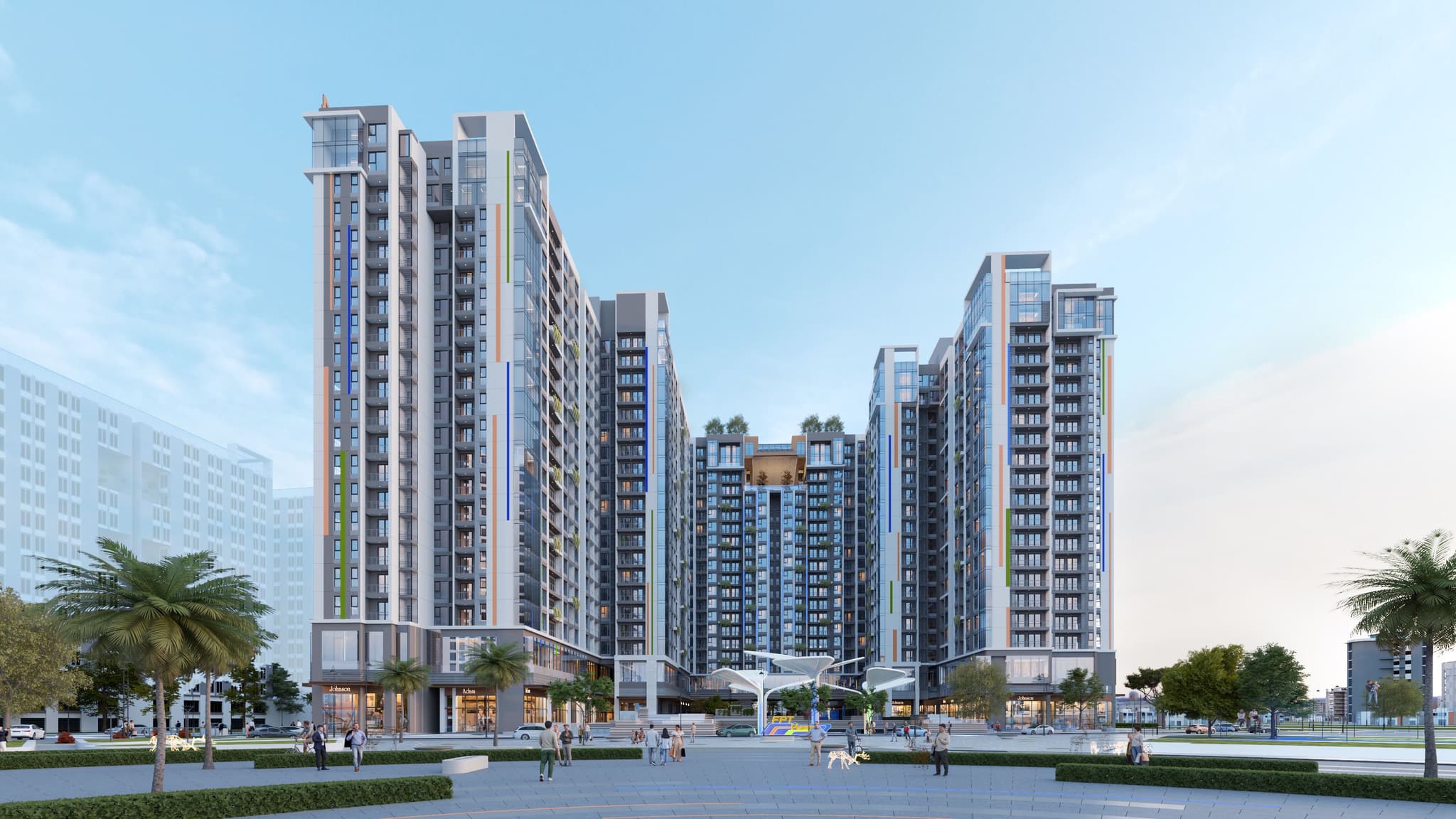 FPT Plaza 4 high-rise apartment buildings with landscaped grounds and palm trees, city skyline view
